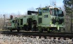 CSX "Signal Joint" repalcement Gang at Cusseta, AL-front three quarter of tamper.  This one has upgrades typical of a Mark VI version.